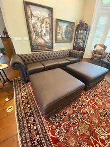 Restored Chesterfield sofa with matching ottomans