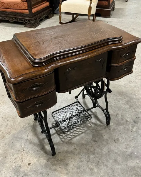 Before and after restoration of an antique treadle sewing table